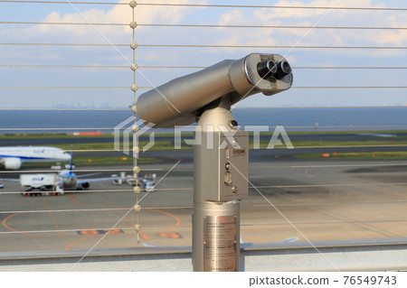 Binocular telescope on the observation deck of Haneda Airport 76549743