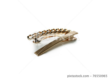 Golden hair clips isolated on white background 76550965