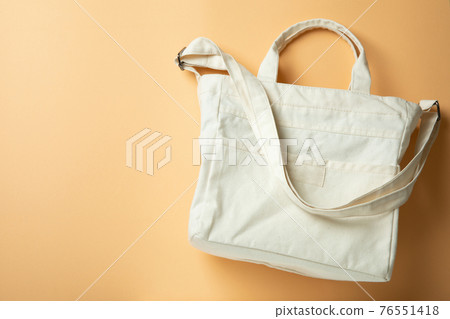 Stylish blank eco bag on beige background 76551418