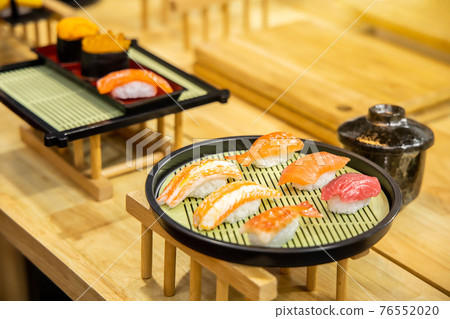 Homemade sushi with salmon, selective focus. Homemade sushi with salmon, selective focus. 76552020