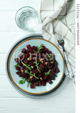 Concept of tasty eating with beet salad on wooden background Concept of tasty eating with beet salad on wooden background 76552152