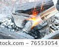 Ignite the charcoal and start the camp 76553054