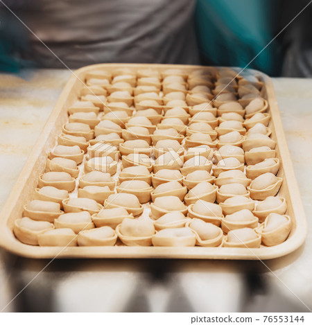 Food, family of dumplings, Favorite dish with different names in different countries. Preparing, cooking. Rustic style. 76553144