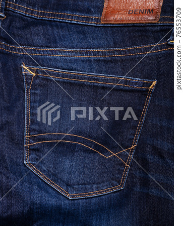 fashion jeans details - back pocket. denim background. studio shot fashion jeans details - back pocket. denim background. studio shot 76553709