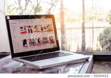 Online shopping website on laptop. Home shopping Online shopping website on laptop. Home shopping 76554433