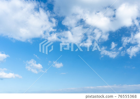 Blue sky. Stratocumulus clouds on blue sky background. 76555368