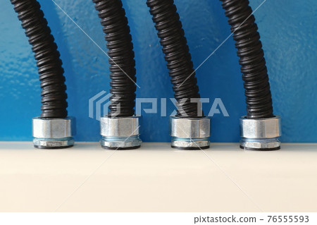 The electrical wires in the corrugated protection are attached to the cable duct by means of nuts. The electrical wires in the corrugated protection are attached to the cable duct by means of nuts. 76555593