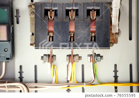 The old manual switch of disconnecting the voltage in the transformer box close-up. The old manual switch of disconnecting the voltage in the transformer box close-up. 76555595