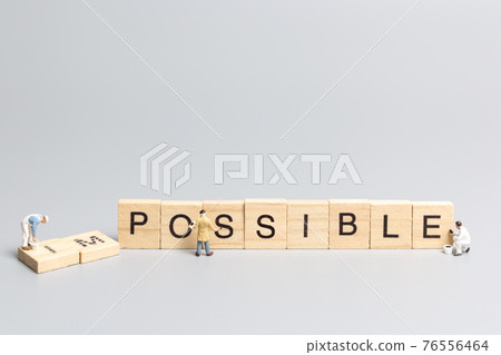Miniature people worker team on impossible word in wooden alphabet letters Miniature people worker team on impossible word in wooden alphabet letters 76556464
