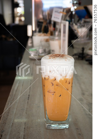 Glass of ice cappucino. Popular coffee menu for espresso short with milk and milk foam. Smooth taste. Glass of ice cappucino. Popular coffee menu for espresso short with milk and milk foam. Smooth taste. 76557536
