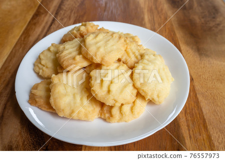 Homemade butter cookies on wooden table. Sweet dessert. Homemade butter cookies on wooden table. Sweet dessert. 76557973
