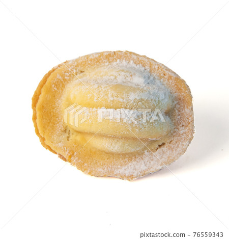 Homemade nut cookies with boiled condensed milk, traditional Russian sweetness isolated on a white background 76559343