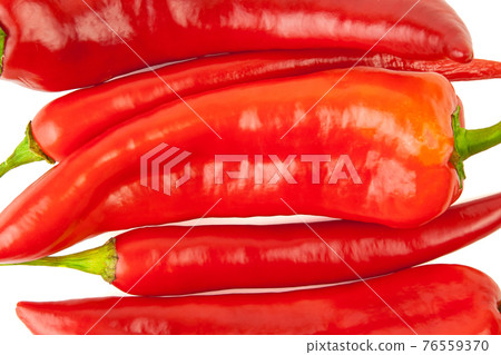 Long sweet peppers and hot cayenne peppers mix isolated on a white background Long sweet peppers and hot cayenne peppers mix isolated on a white background 76559370