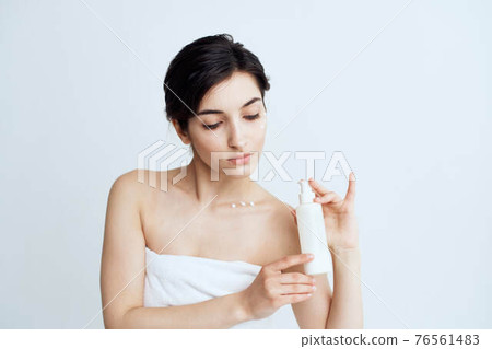 Pretty woman wears skin care cosmetics dermatology Pretty woman wears skin care cosmetics dermatology 76561483