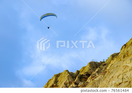Man doing sport, Para-glider in the clouded sky. Man doing sport, Para-glider in the clouded sky. 76561484