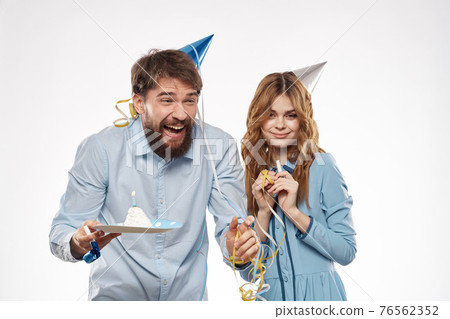 birthday party disco young people with cake and columns fun cropped view close-up 76562352