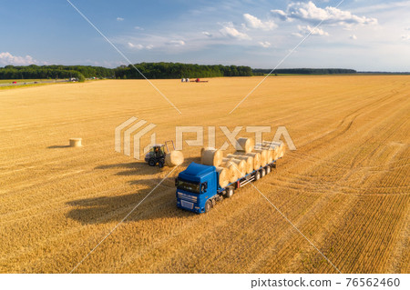 Aerial view of truck with hay bales. Agricultural machinery Aerial view of truck with hay bales. Agricultural machinery 76562460