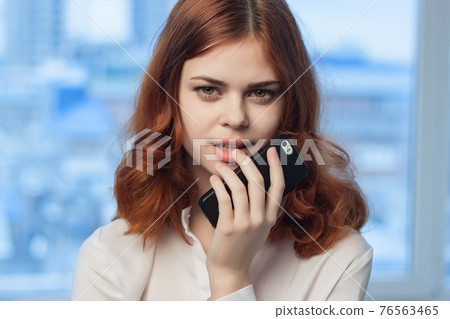 manager in white shirts talking on the phone in the office official 76563465