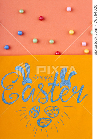 Happy easter handwriting. Yellow paper with happy easter wish. Happy easter handwriting. Yellow paper with happy easter wish. 76564020