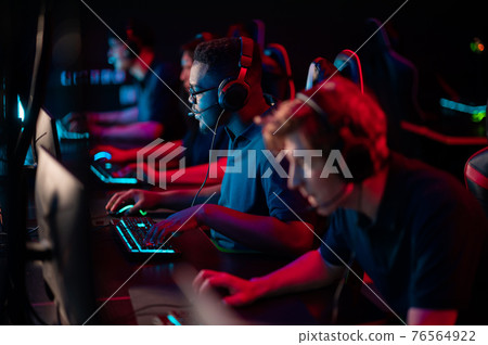 Professional esports players at an online game tournament. The cyber team plays computers and trains 76564922