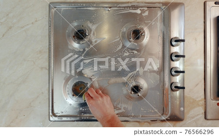 Dirty stove in a kitchen Dirty stove in a kitchen 76566296