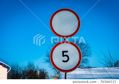 Restriction of movement sign, no entry signor no drive sing on blu sky background Restriction of movement sign, no entry signor no drive sing on blu sky background 76566515