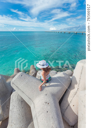 A girl who visited a famous sightseeing spot on Miyakojima A girl who visited a famous sightseeing spot on Miyakojima 76566917