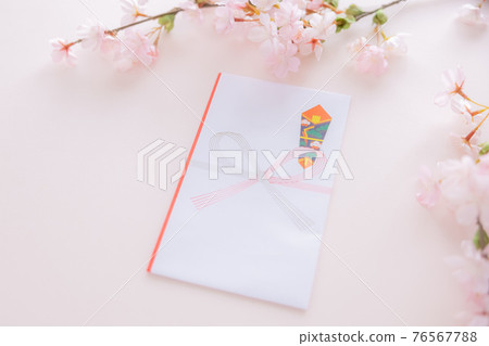 Taking a picture of a cherry blossom and a sushi bag 76567788