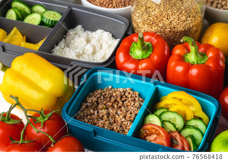 Lunch box with cooked buckwheat and fresh vegetable salad Lunch box with cooked buckwheat and fresh vegetable salad 76568418