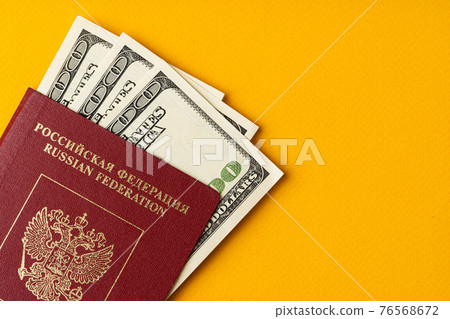 Russian passport with US dollar banknotes inside Russian passport with US dollar banknotes inside 76568672