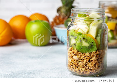 Healthy food: porridge with fruit on the table. Healthy food: porridge with fruit on the table. 76569191