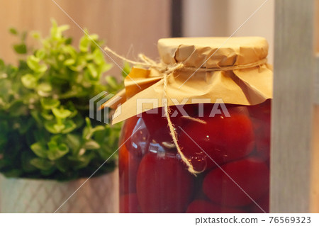 Glass jars with preserved food close up Glass jars with preserved food close up 76569323