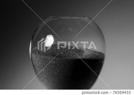 Black and white photo of hourglass close up Black and white photo of hourglass close up 76569433