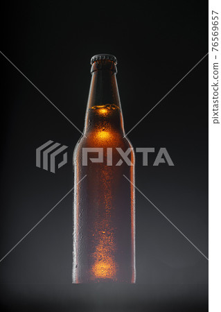 Beer bottle on dark background, copy space Beer bottle on dark background, copy space 76569657