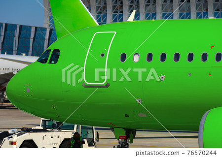Close up of passenger airplane parked in airport 76570244