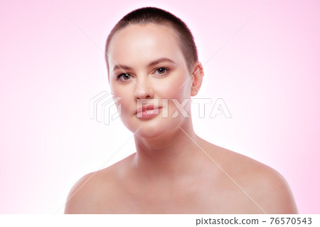 Beauty portrait of a nice young smiling woman with perfect skin Beauty portrait of a nice young smiling woman with perfect skin 76570543
