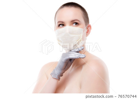 Beauty portrait of a short-haired woman in mask and gloves Beauty portrait of a short-haired woman in mask and gloves 76570744