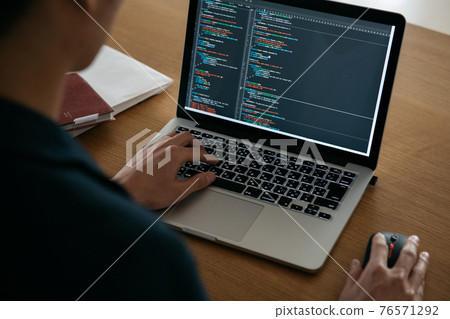 Image of male hand / system engineer to program 76571292