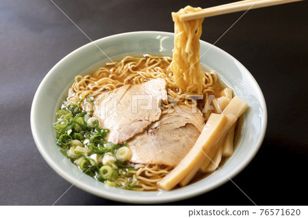 Simple soy sauce ramen on a black background Simple soy sauce ramen on a black background 76571620