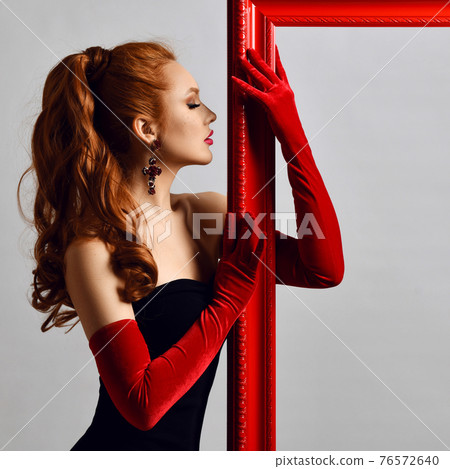 Excited young woman artist in black off-shoulder Excited young woman artist in black off-shoulder 76572640