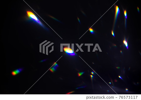 colorful warm rainbow crystal light leaks on black background 76573117