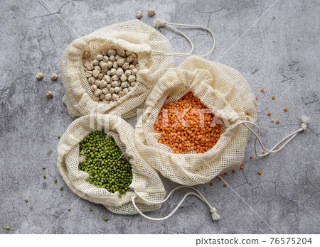 Eco bags with different types of legumes Eco bags with different types of legumes 76575204