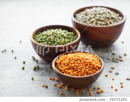 Bowls with different types of legumes Bowls with different types of legumes 76575205