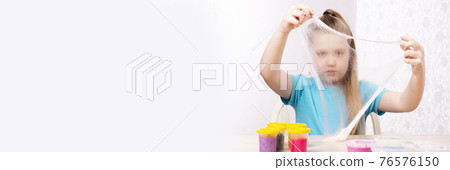 A blonde child is playing with a slime. Little beautiful caucasian girl is playing with many slimes. Play Slime Toy A blonde child is playing with a slime. Little beautiful caucasian girl is playing with many slimes. Play Slime Toy 76576150
