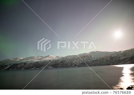 Aurora floating in a full moon fjord 76576689