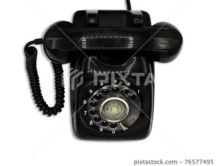 Old black retro rotary Telephone isolated on White background with clipping path. Old black retro rotary Telephone isolated on White background with clipping path. 76577495