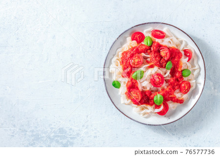 Konjac pasta with tomatoe sauce, shot from the top 76577736