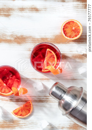 Negroni cocktails with blood oranges and a shaker, top shot 76577777