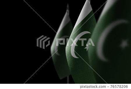 Small national flags of the Pakistan on a black background Small national flags of the Pakistan on a black background 76578206