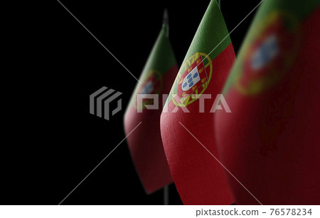 Small national flags of the Portugal on a black background 76578234